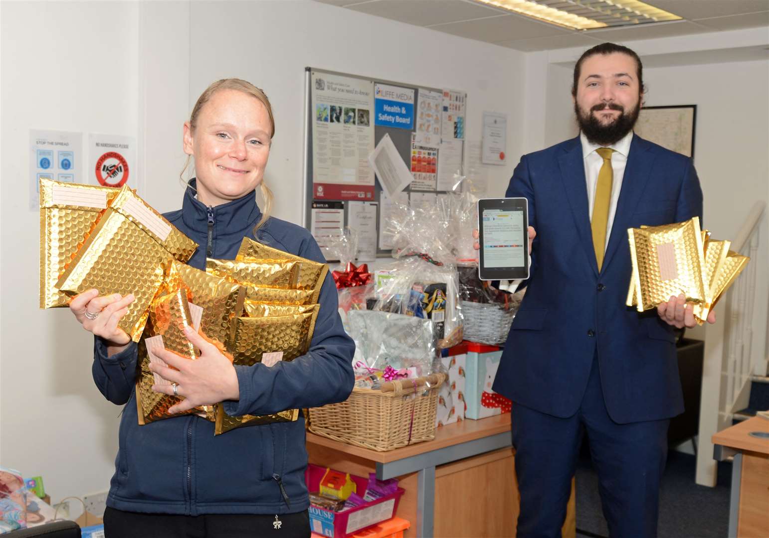 Captain Megan Kervin, of the Salvation Army, with James Moore, general manager of Genmar IT, which donated 16 refurbished computer tablets to our Christmas Toy Appeal. Picture: Vikki Lince (43656075)