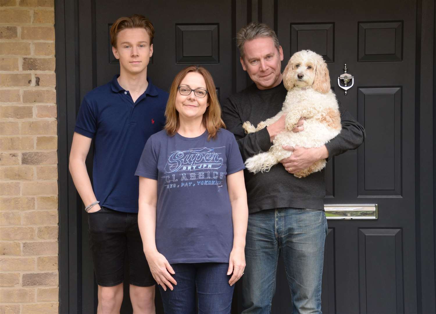 The Wilson family cope with lockdown – Cate with husband Scott, son Jacob and Lily Pickle the dog. Picture: Vikki Lince (33663350)