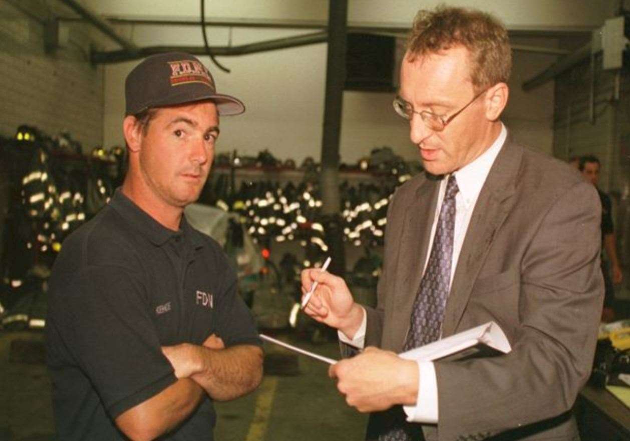Andy Lines talking three days after the 9/11 attacks to New York fireman Mike Kehoe, who escaped from the World Trade Center seconds before its collapse (50981343)