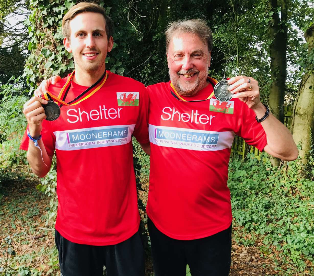 Carl and son Ben with their medals after completing the Berlin Marathon on September 29 last year (28863086)